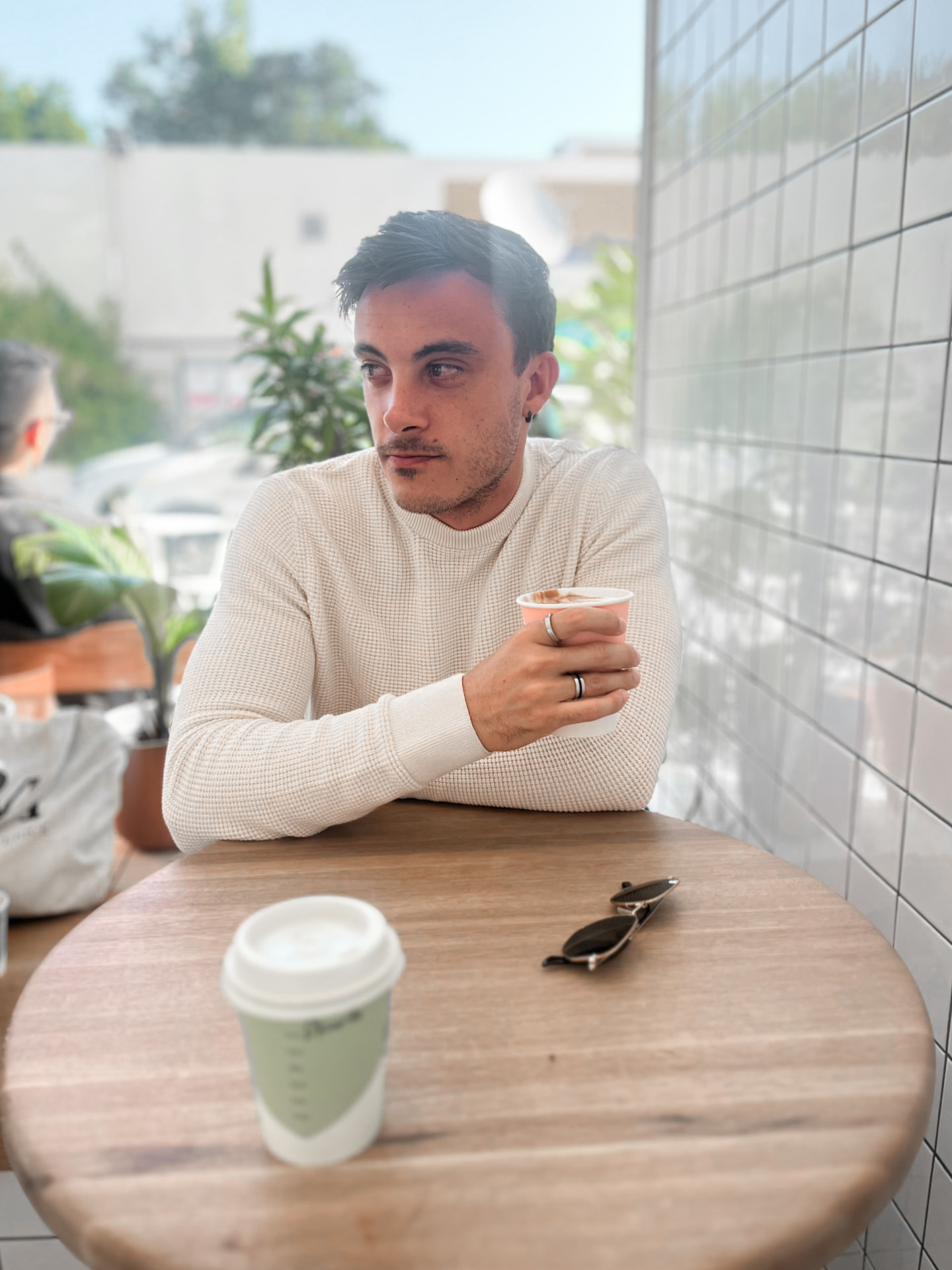 Portrait of Aidan Dean at a Cape Town cafe